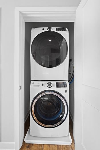 a white full size washer and dryer